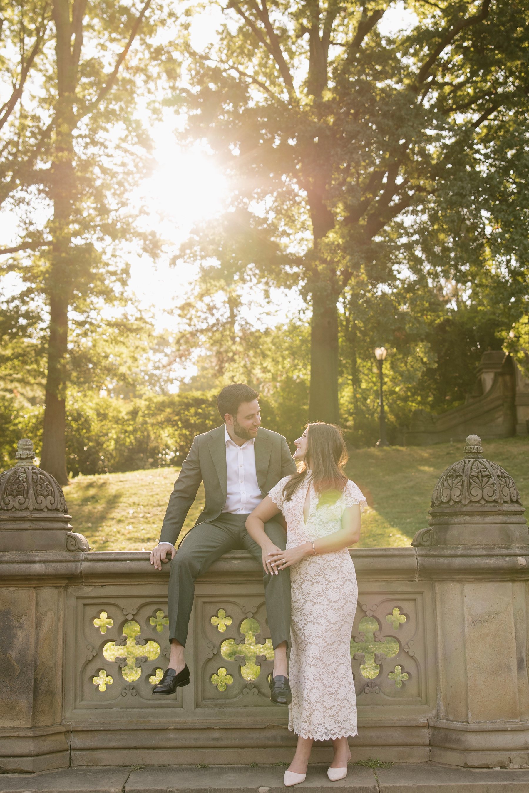 Sydney and Joseph sharing a sunlit moment at Bethesda Terrace